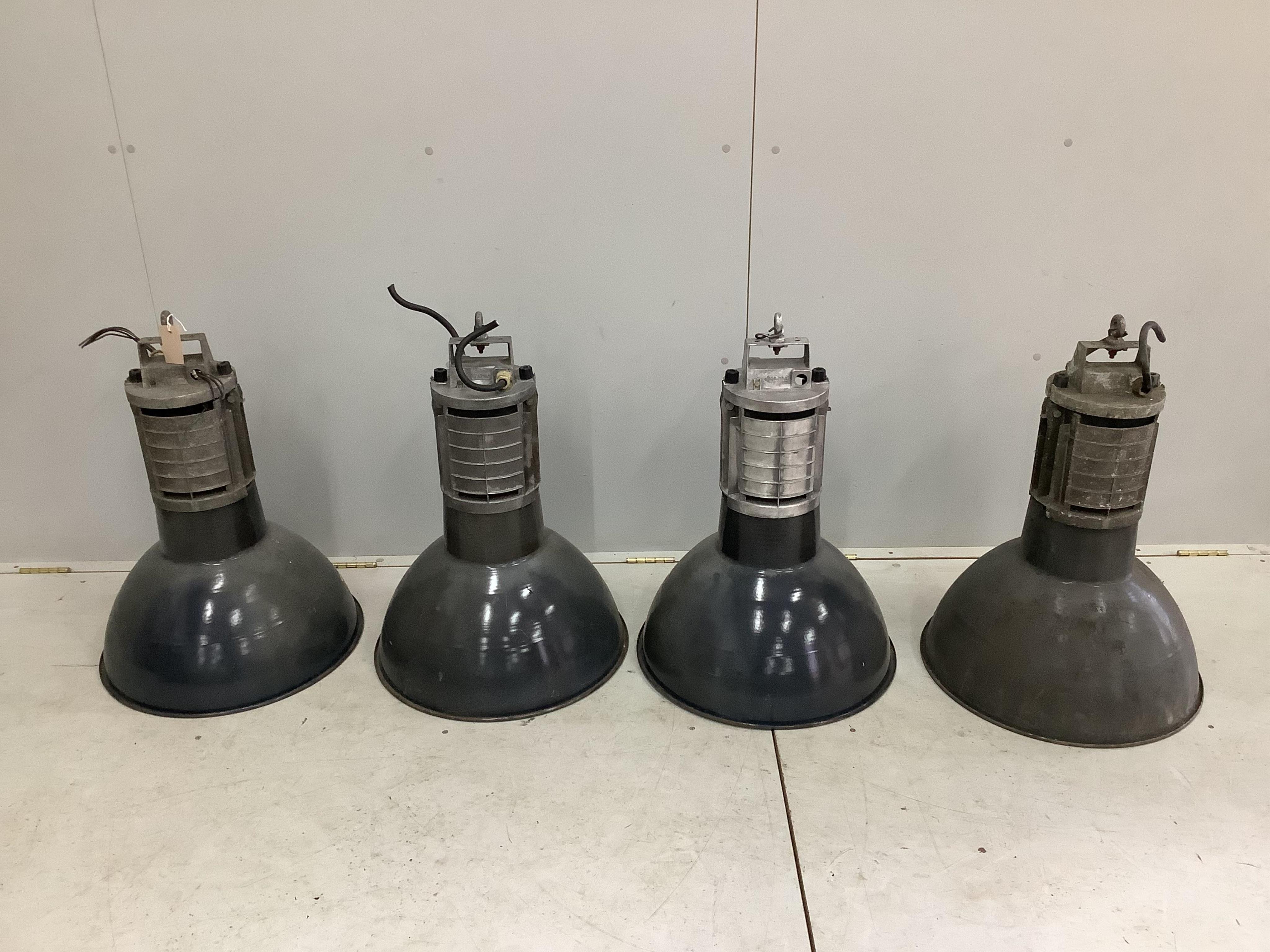 A set of four mid century Mazda industrial ceiling lights, height 68cm, diameter 50cm and one other light. Condition - fair to good, will need re-wiring